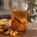 Bocal de rhum arrangé mirabelle en macération avec une gousse de vanille